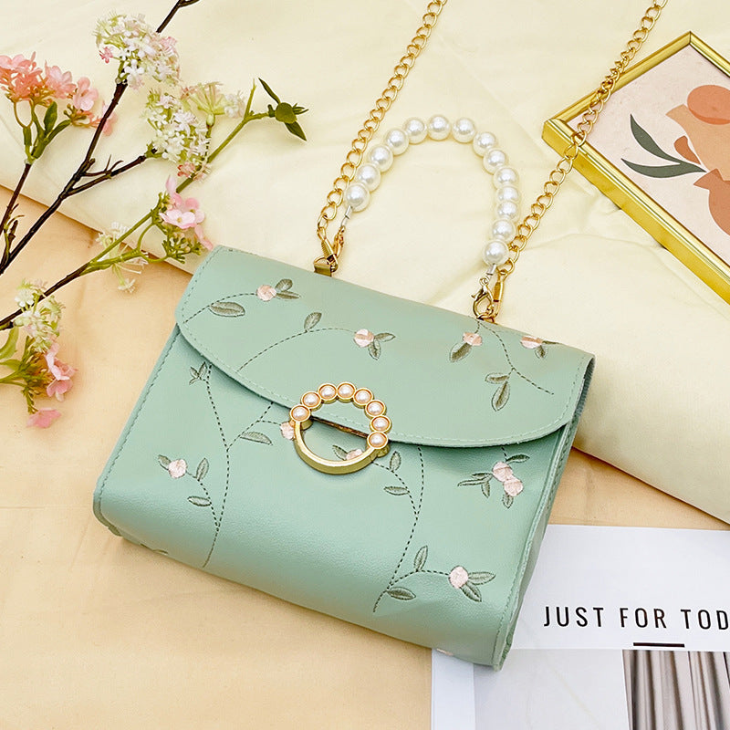 Wholesale bag with embroidered pearls and magnetic buckle chain